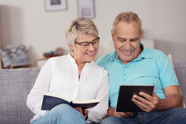Happy Matured Couple Watching Something on Tablet - Фото, изображение