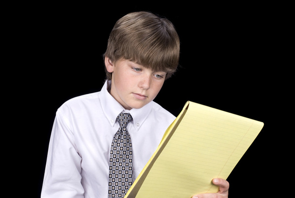 Boy in business dress reading notepad - Zdjęcie, obraz