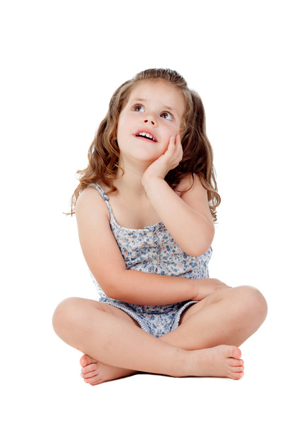 Pensive little girl with three year old sitting on the floor - Φωτογραφία, εικόνα