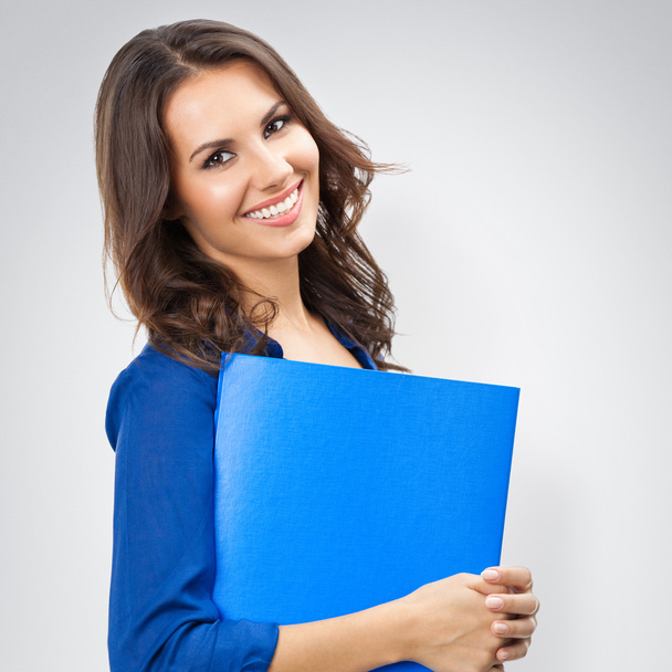 happy smiling businesswoman with blue folder with copyspace, on  - Фото, изображение