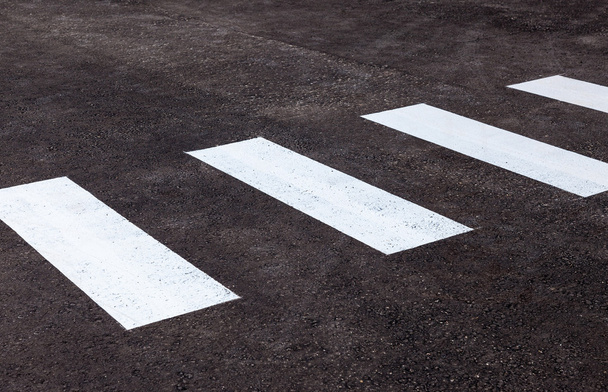 Zebra crossing with white marking lines on asphalt - Fotó, kép