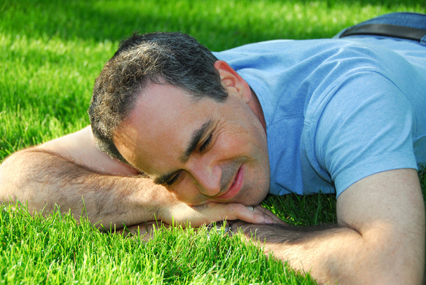 Man on grass - Фото, изображение