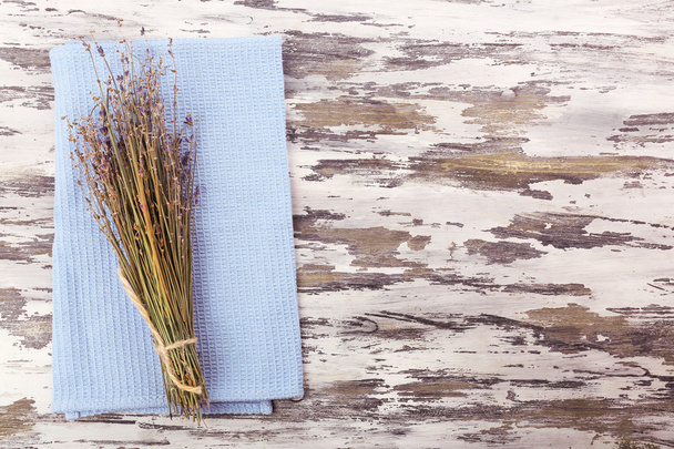 Beautiful dry flowers on napkin on wooden background - Foto, Bild