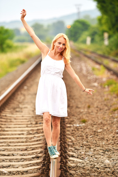 pregnant woman on rails - Valokuva, kuva