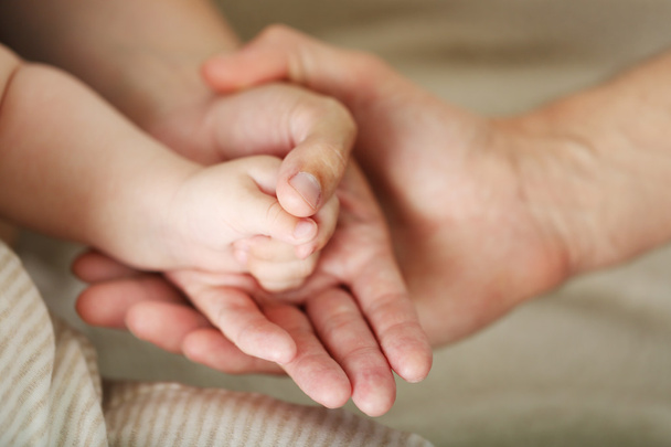 Adult and baby hands, closeup - Foto, Imagem
