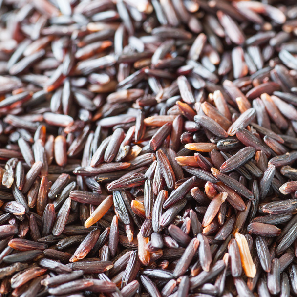 Healthy uncooked brown rice as background - Foto, afbeelding