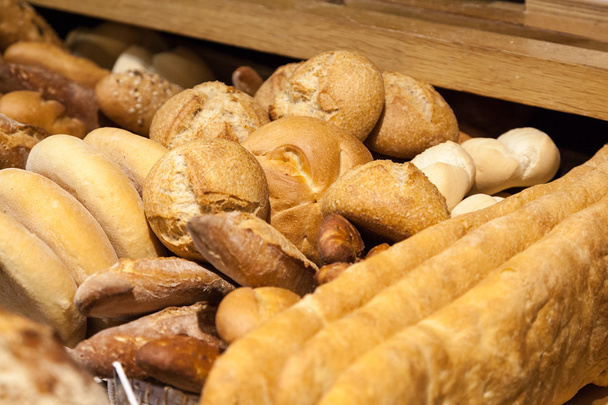 Delicious fresh bread in a bakery - Фото, изображение