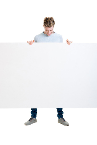 Happy teenager holding  blank banner - Photo, image