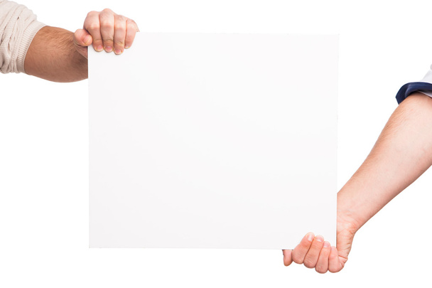 Mãos segurando uma placa branca em branco
 - Foto, Imagem