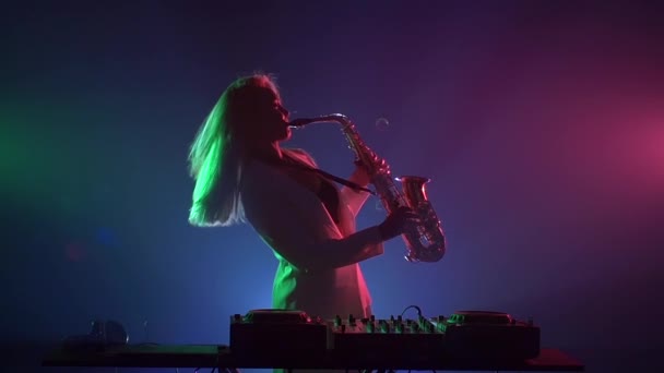 Woman playing music using saxophone - Footage, Video