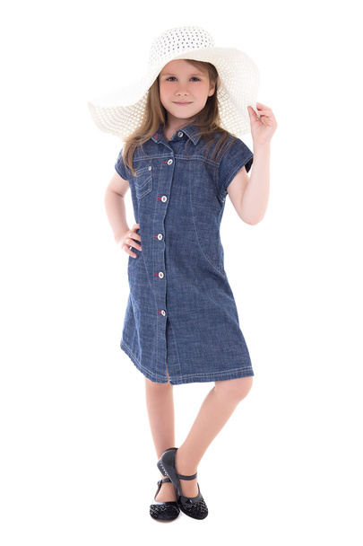 cute little girl in denim dress and big summer hat isolated on w - Foto, imagen