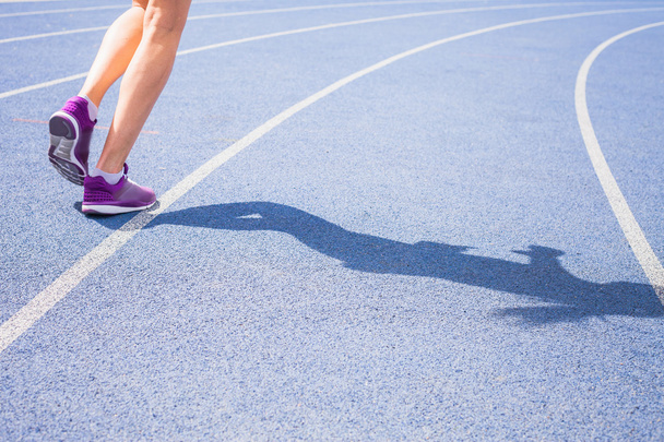 sprint of womens feet jogging outdoor by the road - Zdjęcie, obraz