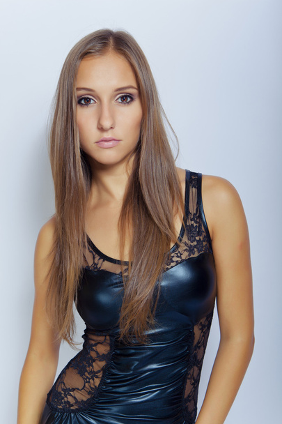 Sexy young girl in black dress - Foto, imagen