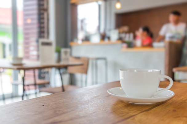Coffee cup on table in cafe - Φωτογραφία, εικόνα