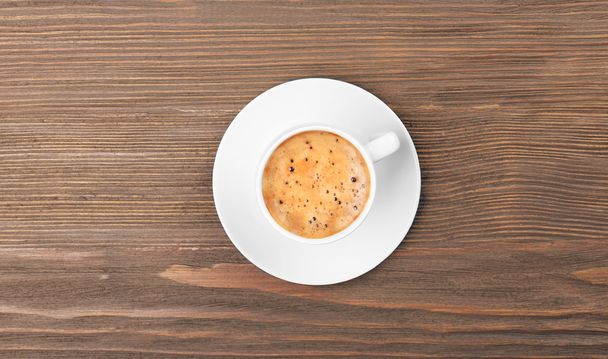 Cup of coffee on wooden table - Foto, Imagen