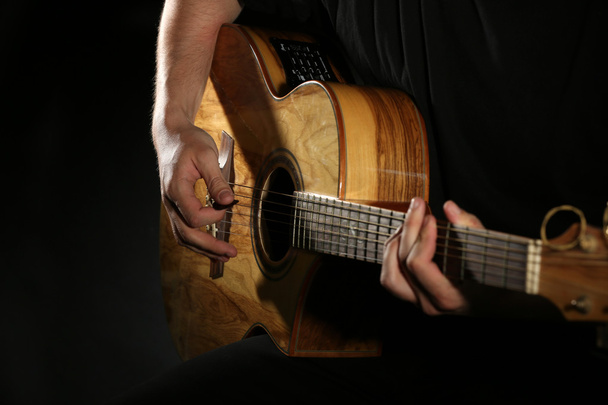 man playing on guitar - Fotó, kép
