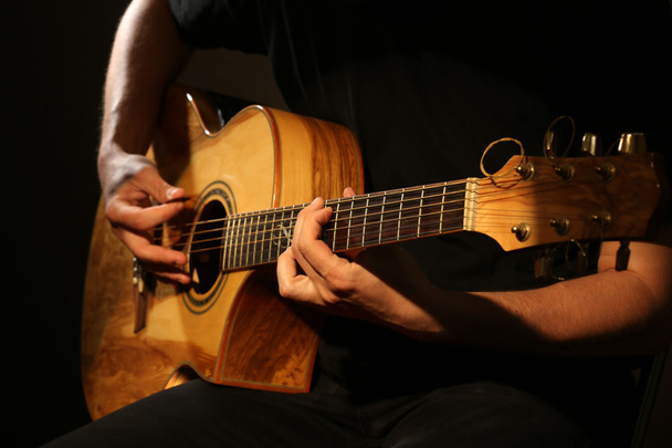 man playing on guitar - Fotografie, Obrázek