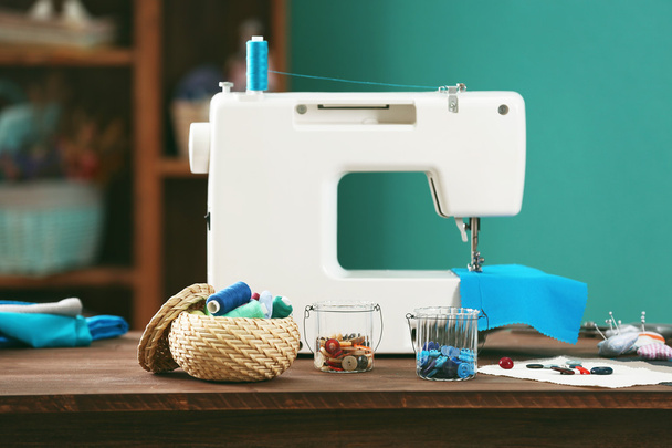 Sewing machine on table - Фото, изображение