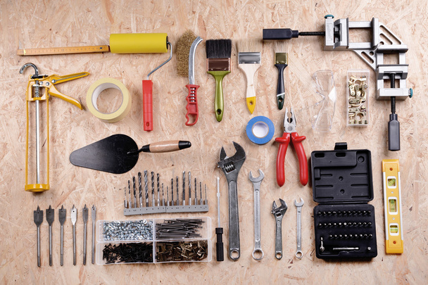 Set of tools on plywood, top view - 写真・画像
