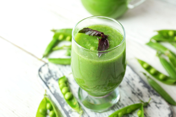 Healthy green smoothie with peas on wooden table, closeup - Фото, зображення