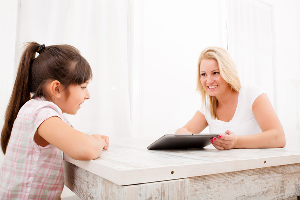 Mother and Daughter with a Tablet PC - Foto, Bild