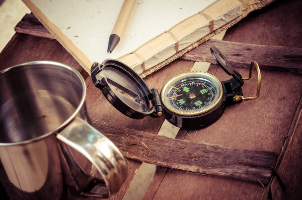 cup of coffee with compass and notepad - 写真・画像