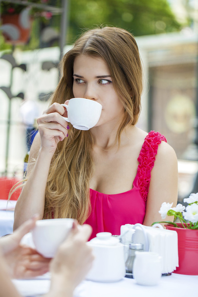 Pretty young blonde woman sitting in the cafe  - Foto, Imagem