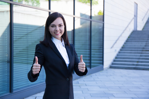 career concept - business woman thumbs up over modern city backg - Photo, Image