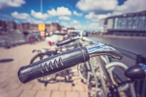 Bicycles parked in Amsterdam, Netherlands - retro and vintage st - 写真・画像