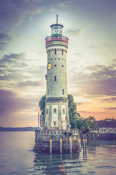 Mysterious lighthouse at evening in harbor of Lindau - retro and - 写真・画像