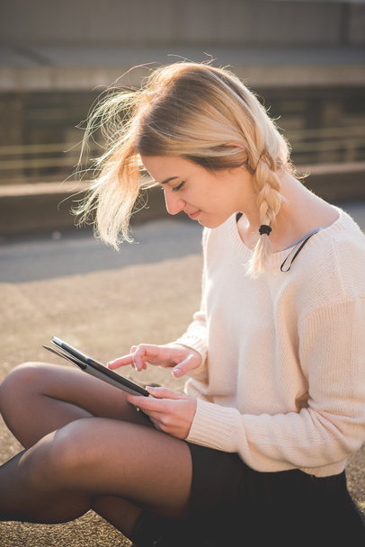 blonde woman outdoor using tablet - Photo, Image