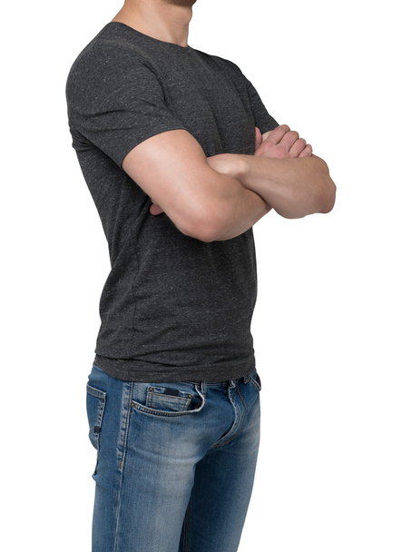 Side view of a man in a dark grey t-shirt with crossed hands. Isolated - Photo, image