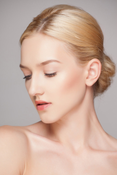 Fashion  blonde woman with beautiful face - isolated on white. Skin care concept. - 写真・画像