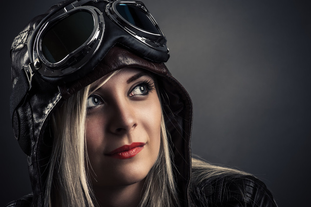 portrait of a beautiful girl in aviator helmet - Fotografie, Obrázek