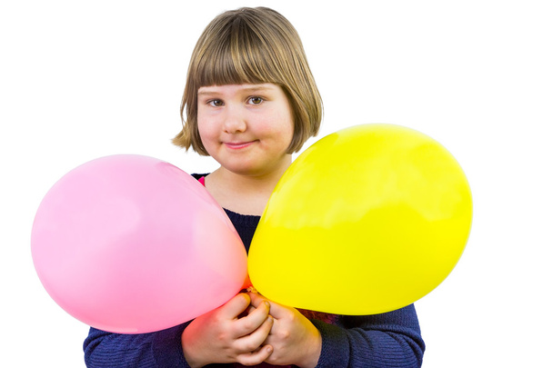 Young dutch girl holding two balloons - Fotó, kép