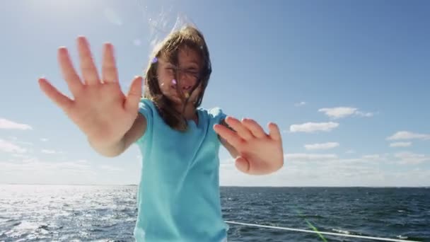 Young girl on luxury yacht in the ocean - Footage, Video