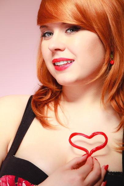 Girl holding valentine red heart love symbol. Valentines day. - Фото, зображення