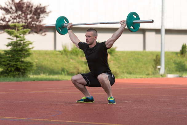 Young Man Doing A Overhead Squat Exercise Outdoor - Photo, image