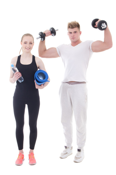 young man and woman in sportswear with dumbbells and yoga mat is - Foto, afbeelding