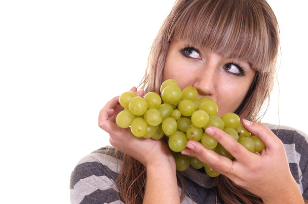 Girl eating grapes - Фото, зображення
