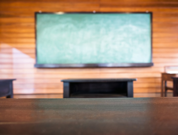 Table top with Blurred Blackboard Education background concpet - Photo, Image