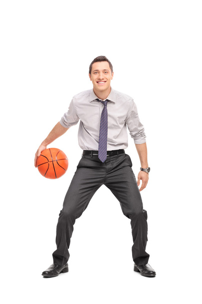 Young businessman playing basketball  - Valokuva, kuva