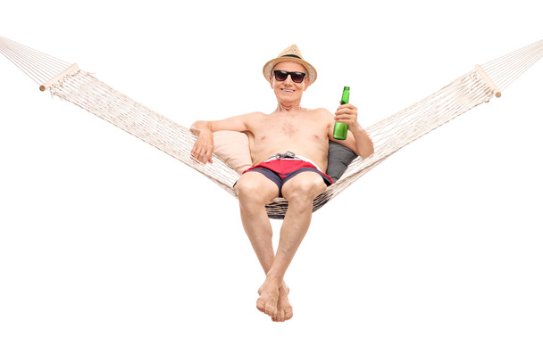 Relaxed senior lying in a hammock  - Photo, Image
