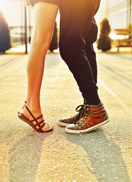 Couple in love. Male and female legs closeup  - Photo, Image