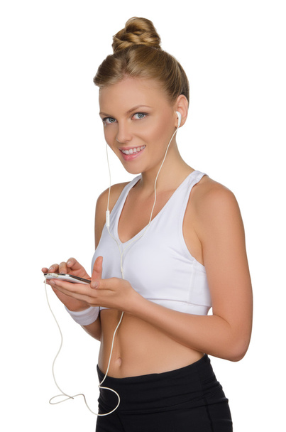charming athletic woman with headphone and phone - Foto, Imagem