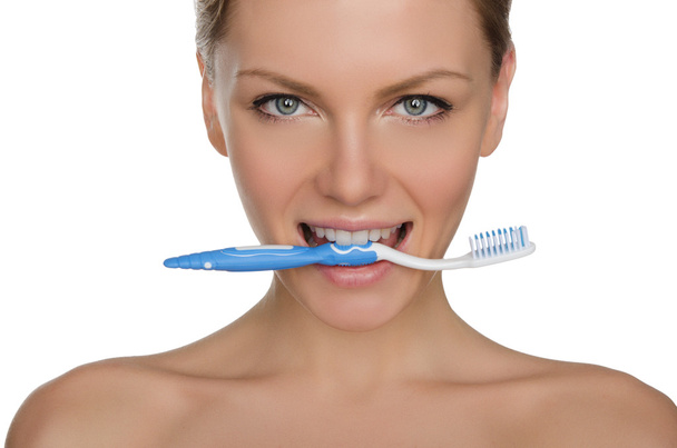 Portrait happy woman with toothbrush in teeth - Фото, изображение