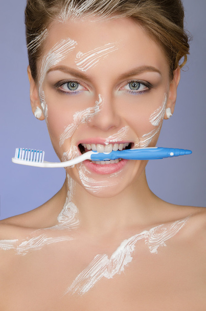 woman with toothbrush mouth and in toothpaste - Foto, Imagen