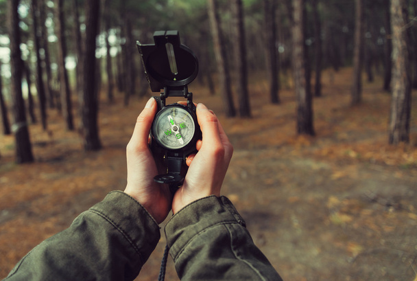 POV of hands with a compass - Foto, afbeelding