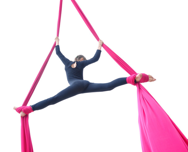 cheerful child training on aerial silks, isolated over white - Photo, Image