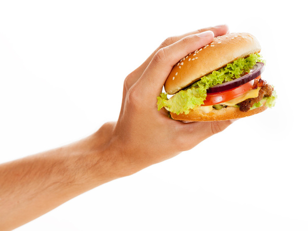 Hands holding a hamburger - Foto, imagen